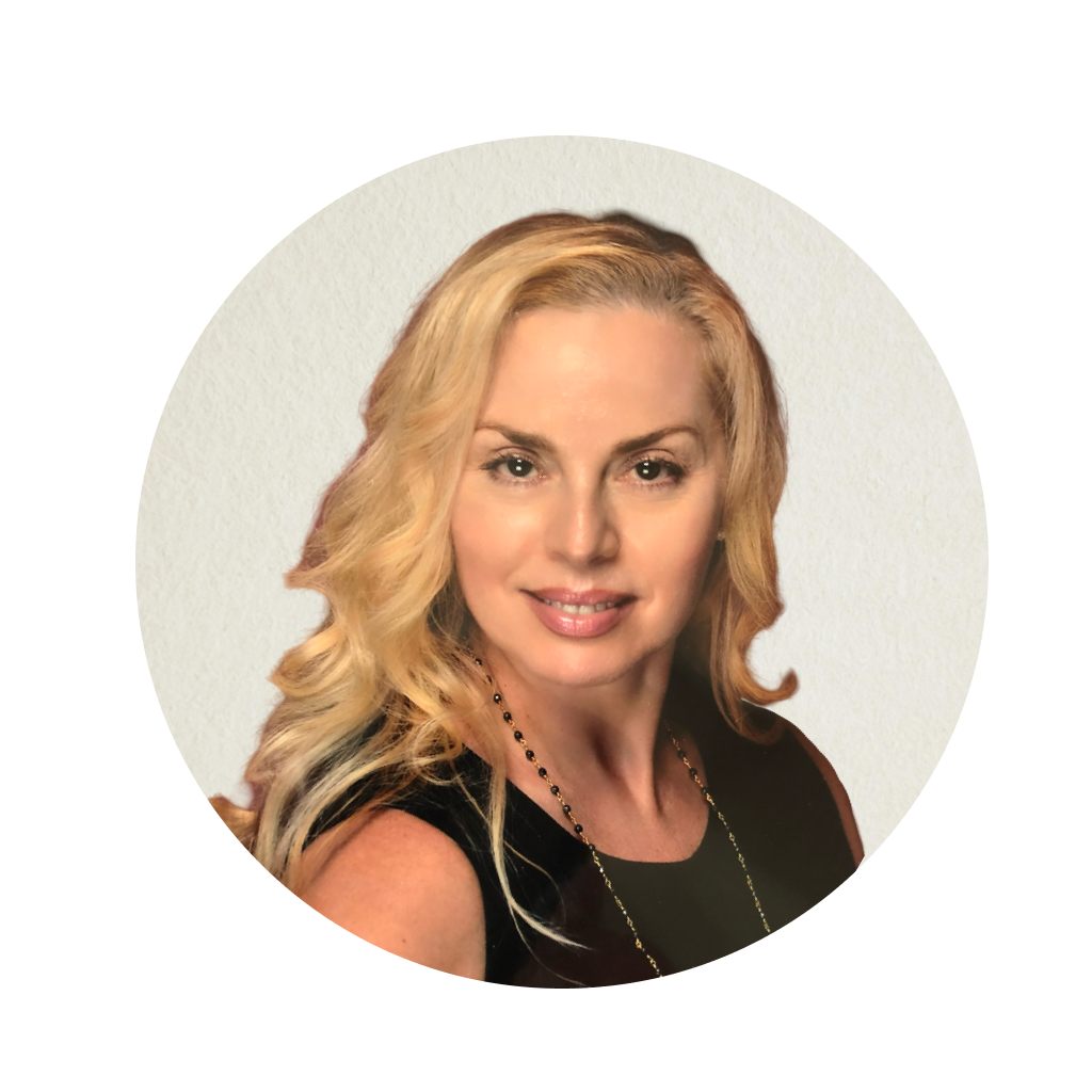 The image is a portrait of a woman with blonde hair, wearing a black top and a necklace, posing for a professional headshot against a light background.